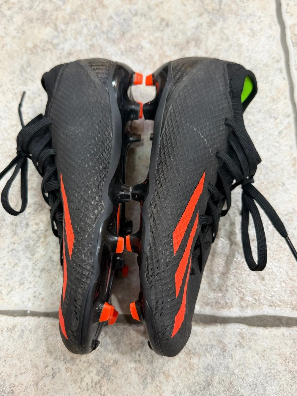Adidas Kids' Black Soccer Cleats with Orange Stripes size 2